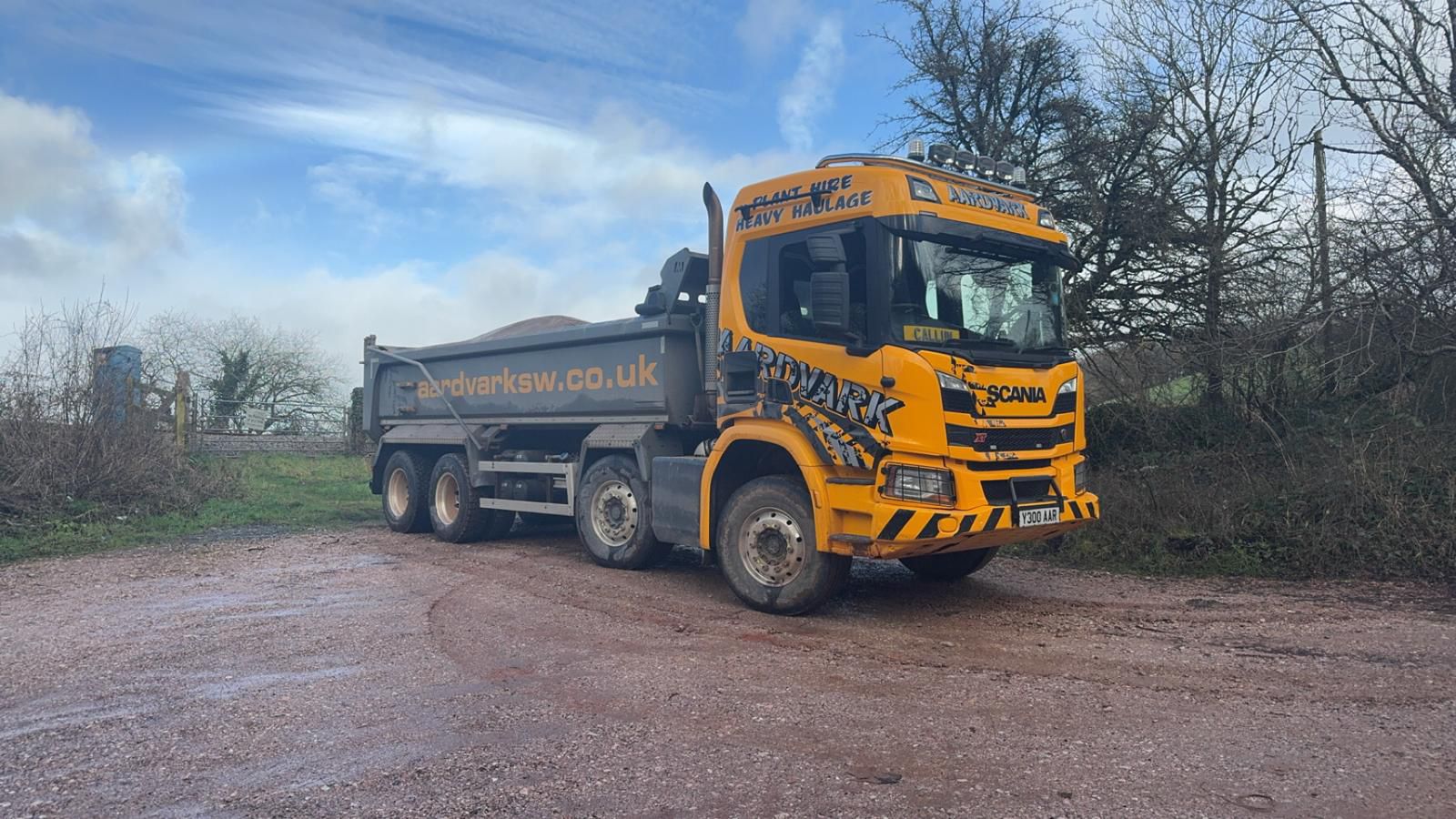 Aardvark muck away truck clearing spoil from a construction site in Exeter, providing professional muck shifting and waste removal services across Devon and the South West.